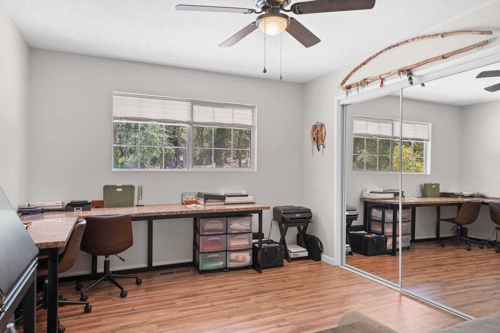 8710 Redbank Road Redding, CA 96001 - Photo 24 of 27 a view of a workspace with furniture and a window