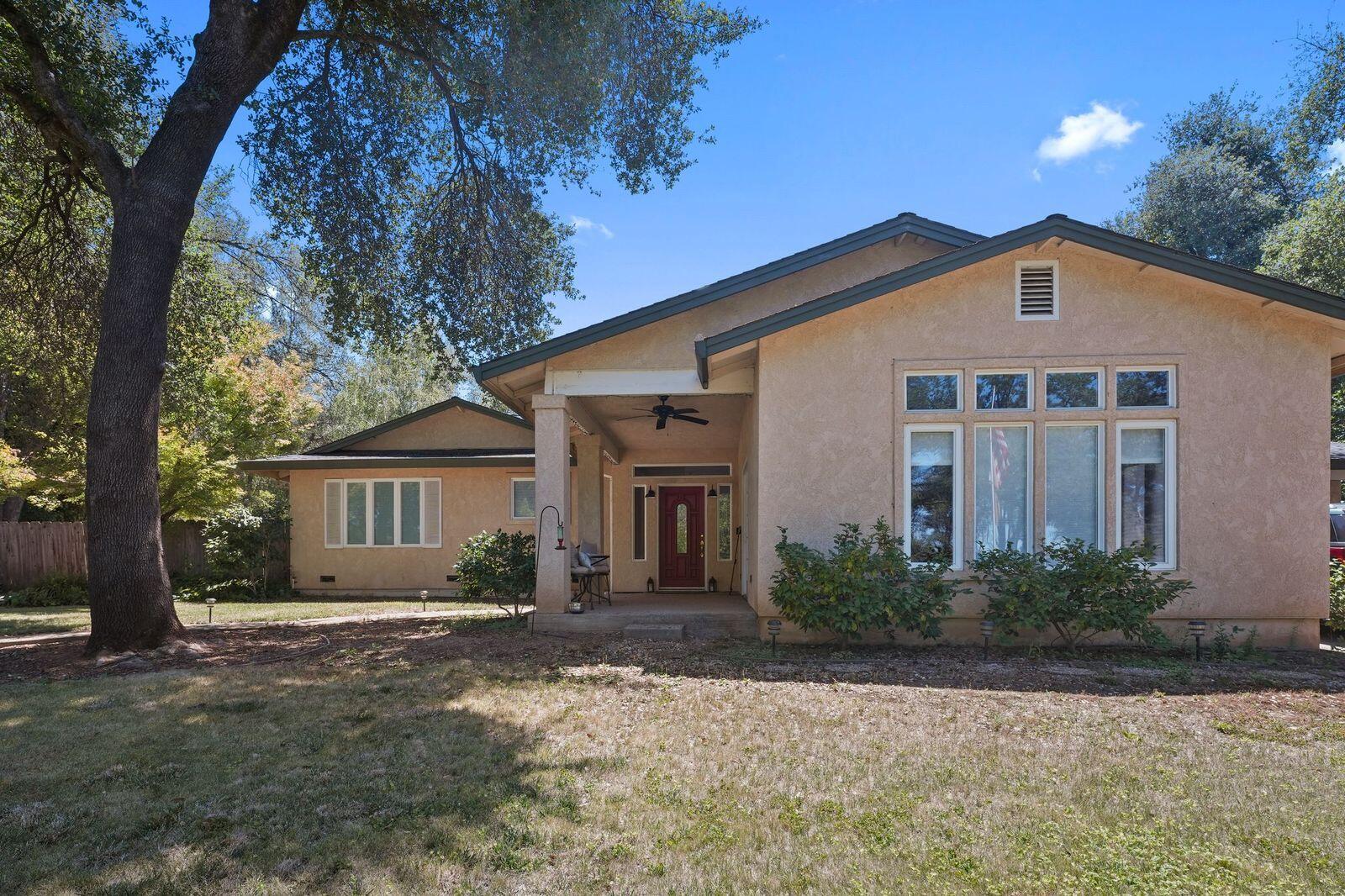 8710 Redbank Road Redding, CA 96001 - Photo 3 of 27 a front view of a house with garden