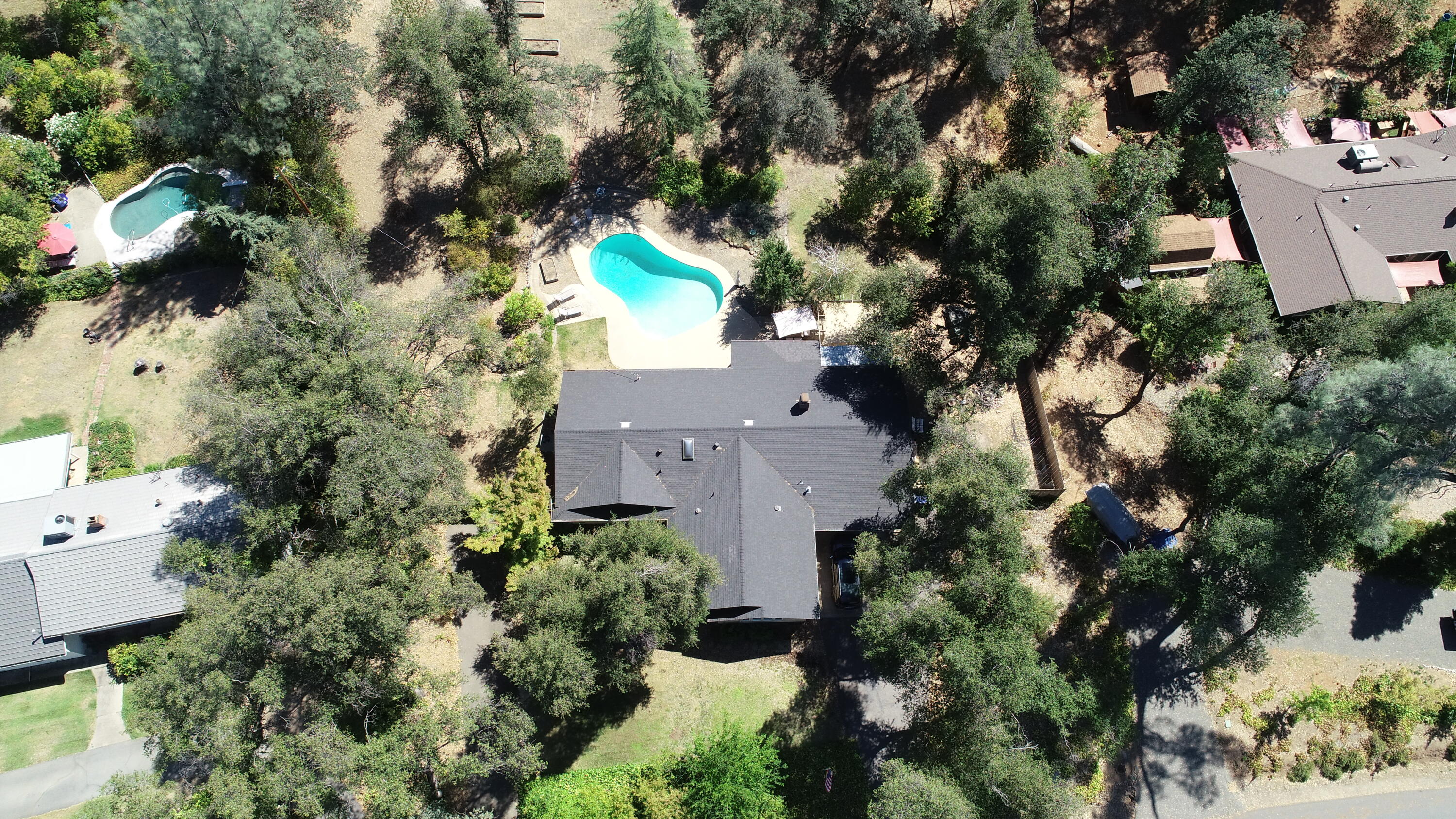 8710 Redbank Road Redding, CA 96001 - Photo 5 of 27 an aerial view of a house with a yard and garden