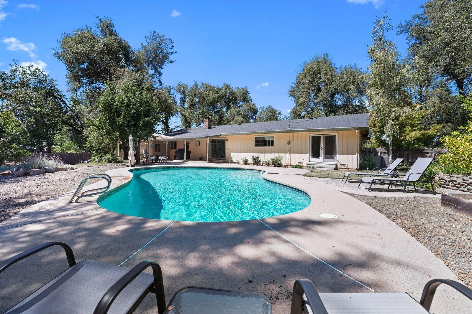 8710 Redbank Road Redding, CA 96001 - Photo 9 of 27 a view of a swimming pool with chairs