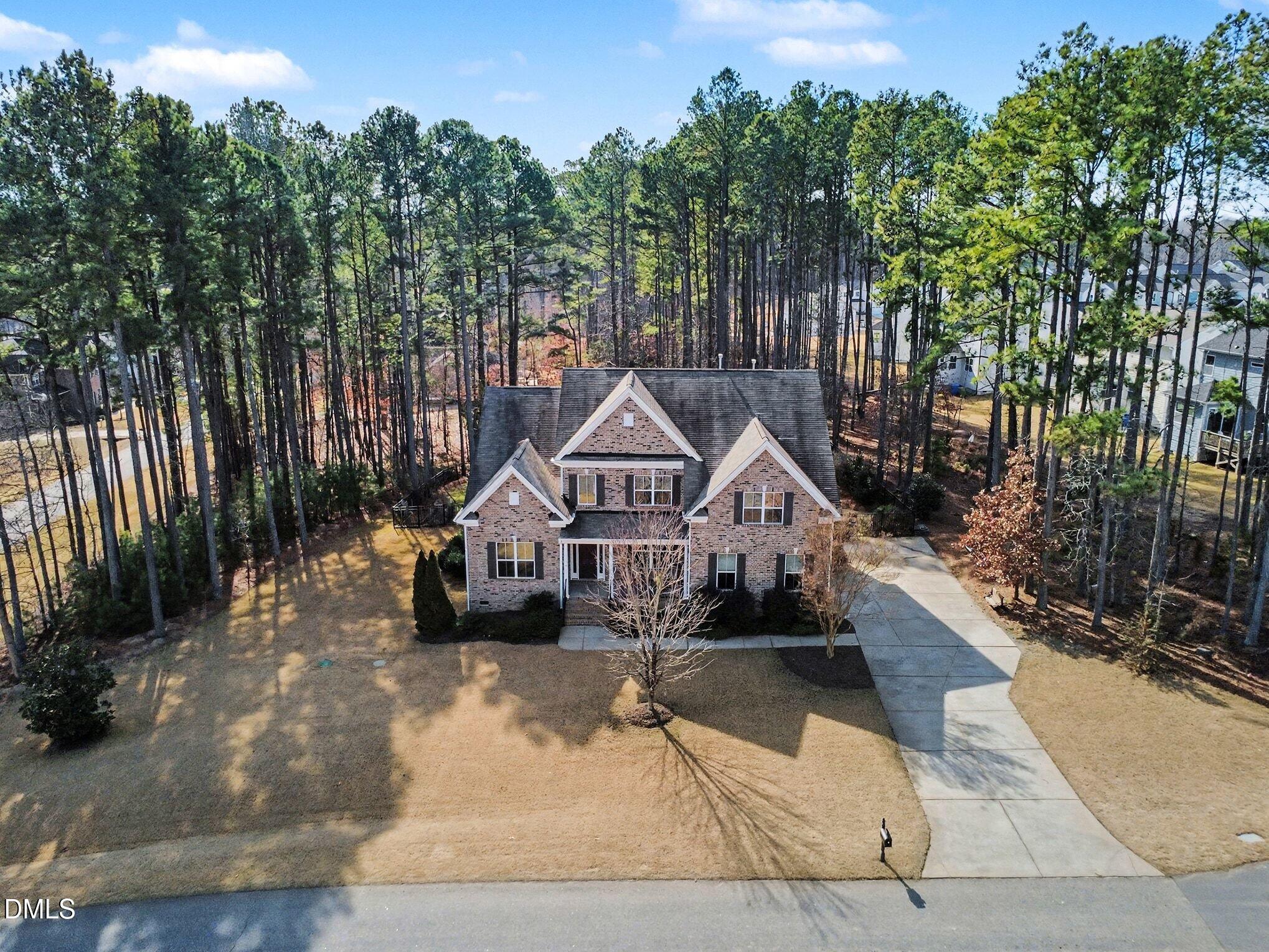 3213 Lebrun Path Fuquay-Varina, NC 27526 - Photo 1 of 58 a view of a house with wooden fence