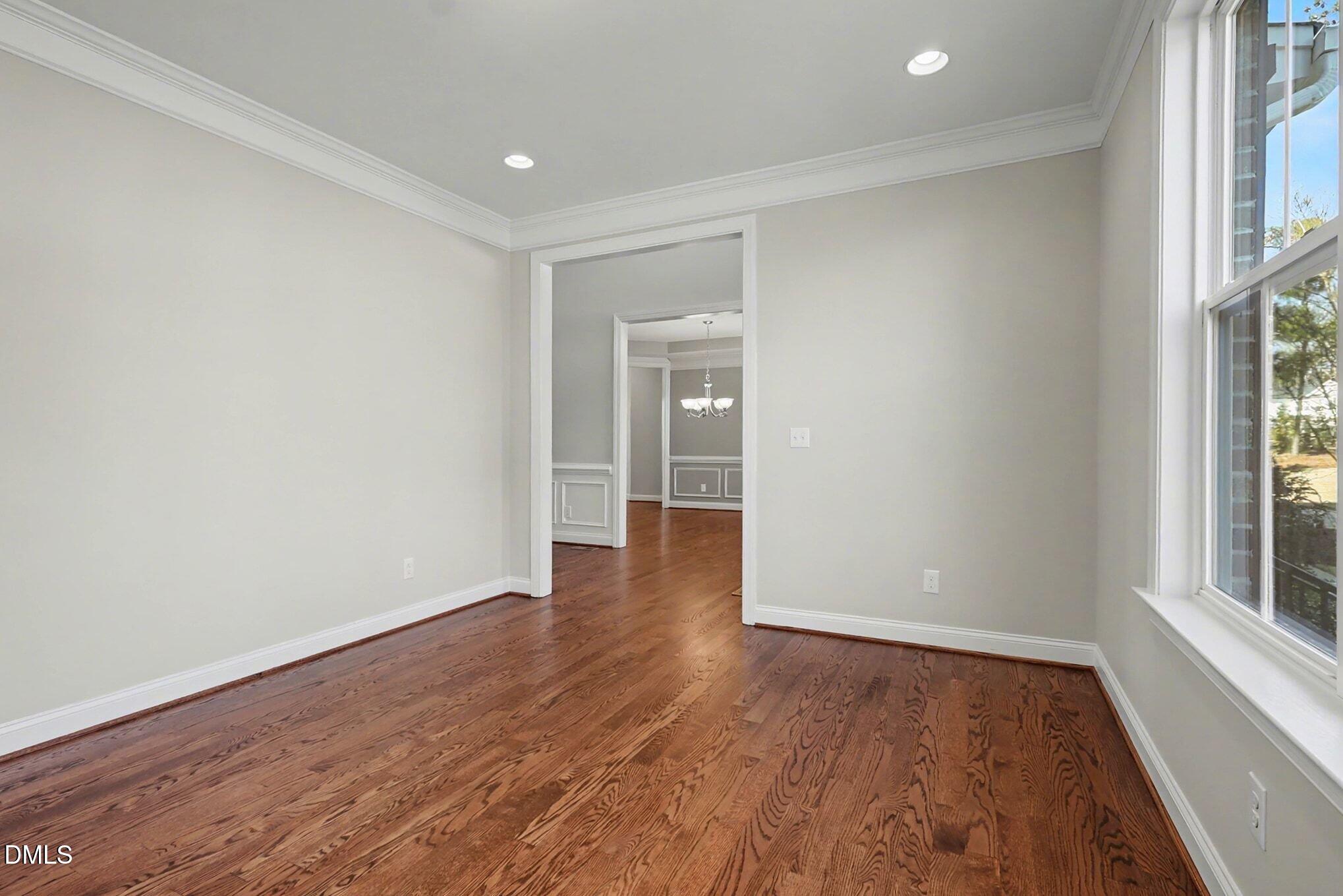 3213 Lebrun Path Fuquay-Varina, NC 27526 - Photo 23 of 58 wooden floor in an empty room with a window