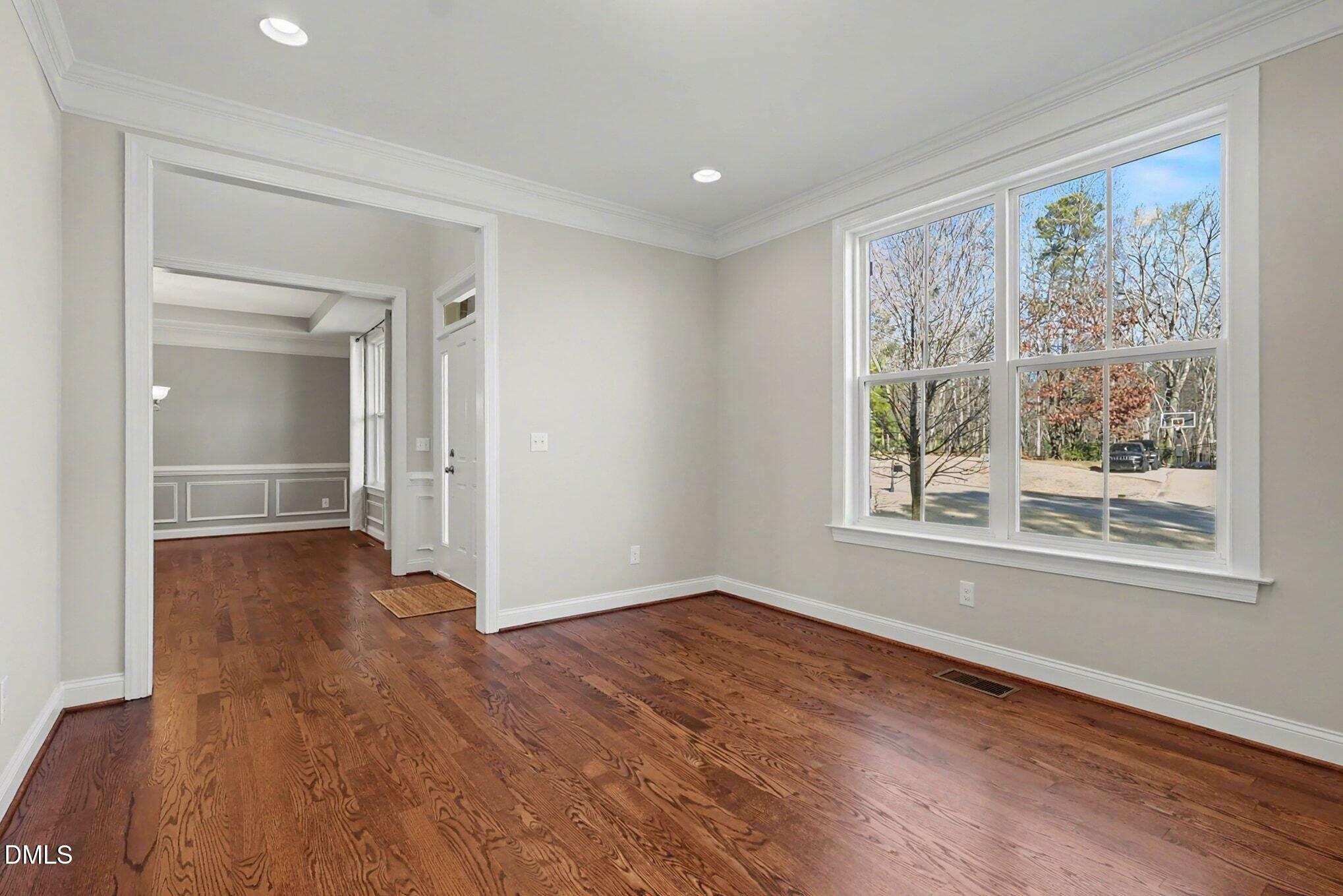 3213 Lebrun Path Fuquay-Varina, NC 27526 - Photo 25 of 58 a view of empty room with wooden floor and fan