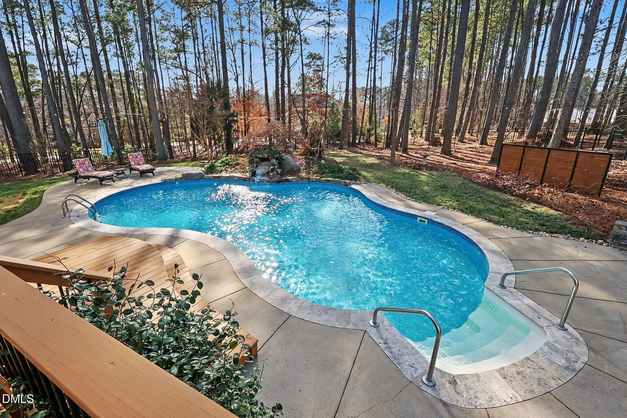 3213 Lebrun Path Fuquay-Varina, NC 27526 - Photo 5 of 58 a view of outdoor space with swimming pool and trees in the background