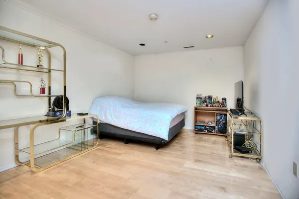 a bedroom with furniture and a book shelf