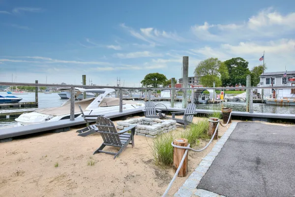 a view of a swimming pool with outdoor seating