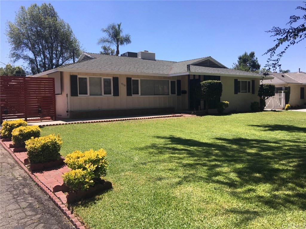 4530 Emerson Street Riverside, CA 92506 - Photo 1 of 1 a front view of a house with a yard