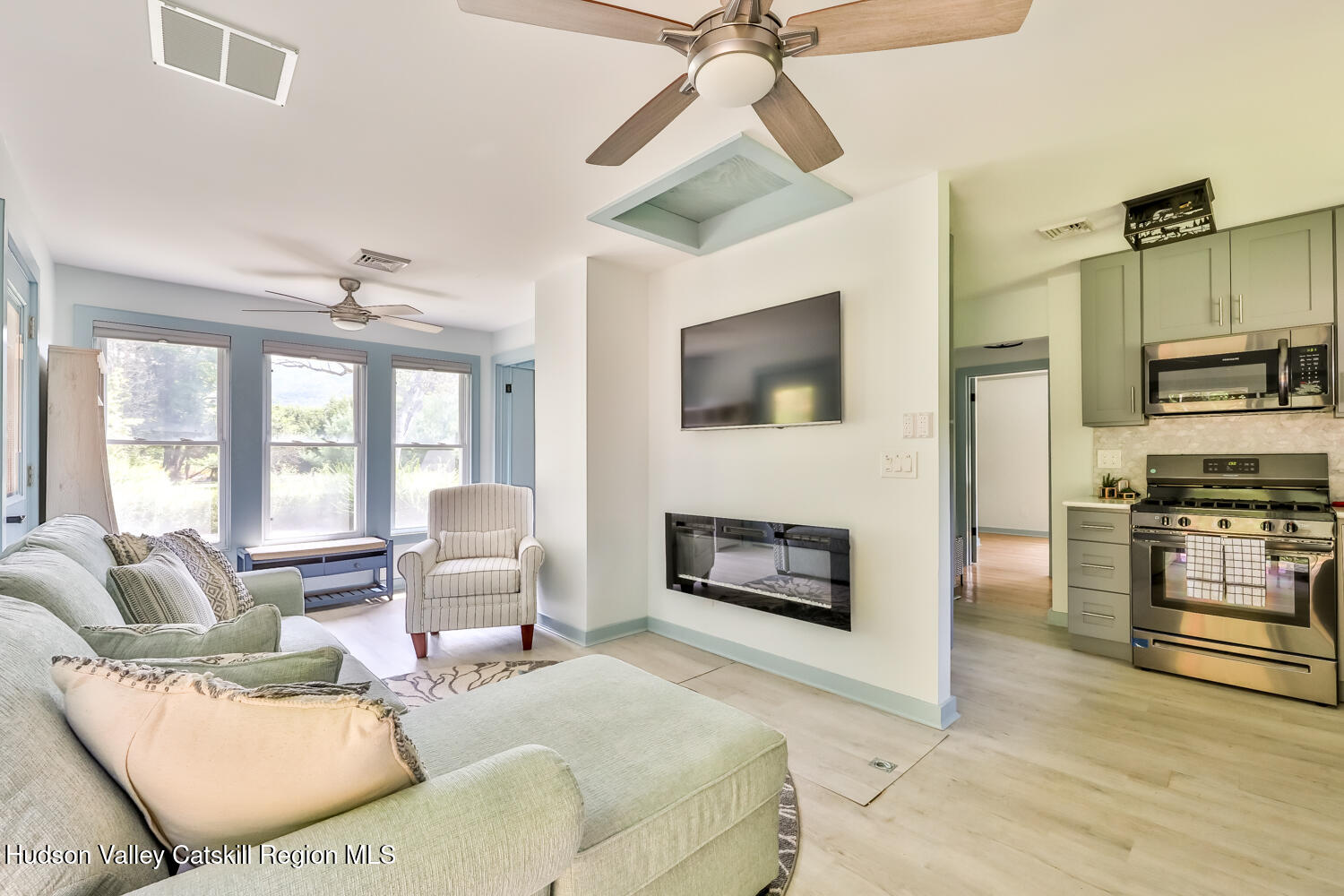 10398 Highway 23A Jewett, NY 12442 - Photo 23 of 55 a living room with furniture fireplace and flat screen tv