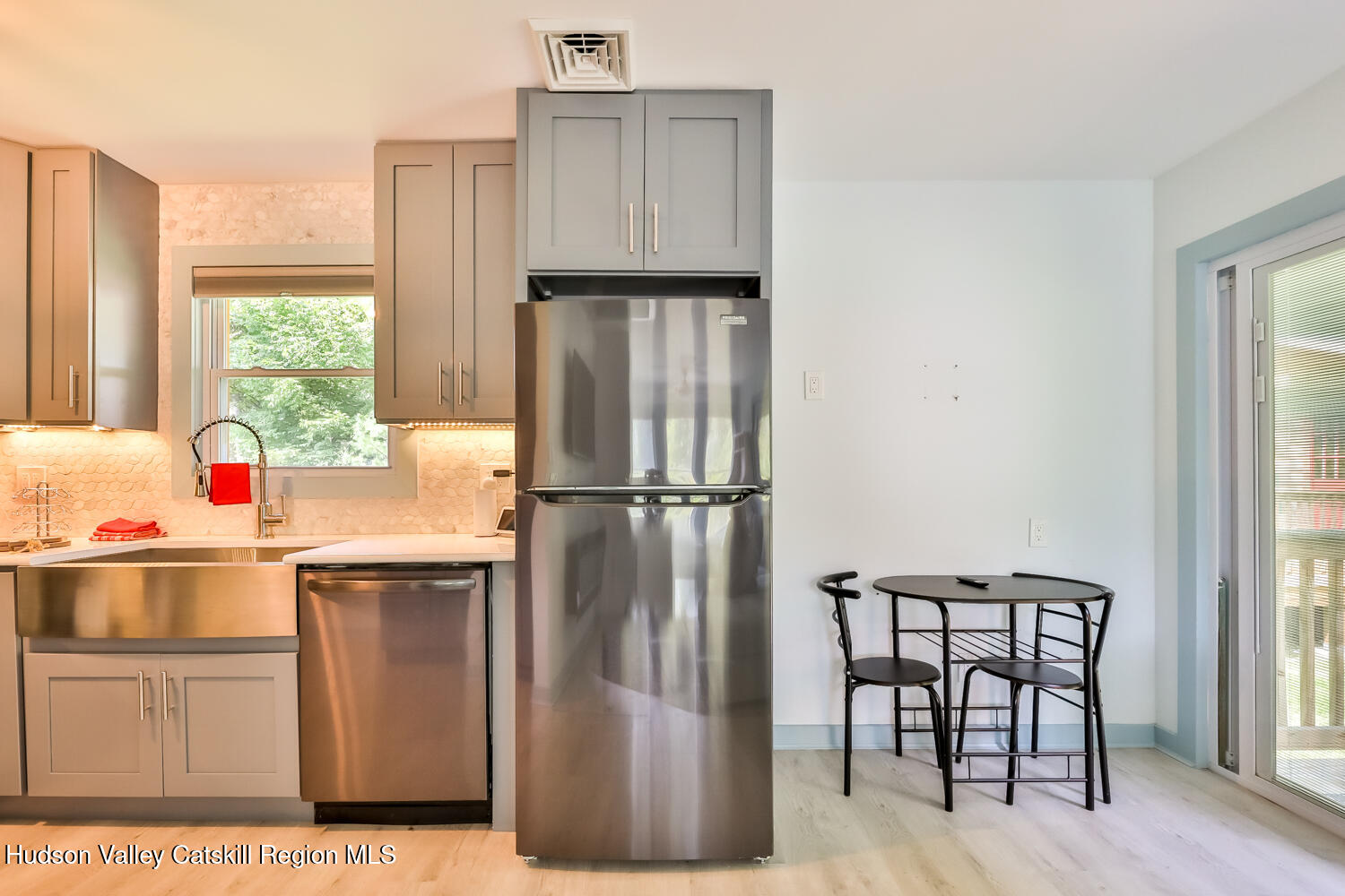10398 Highway 23A Jewett, NY 12442 - Photo 25 of 55 a kitchen with a refrigerator and a window