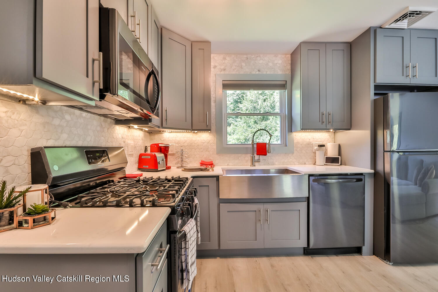 10398 Highway 23A Jewett, NY 12442 - Photo 28 of 55 a kitchen with stainless steel appliances a sink stove and refrigerator