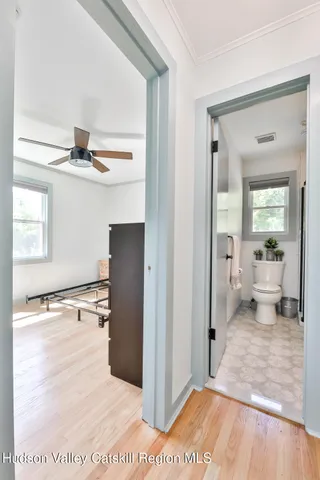 a bedroom with furniture and a window