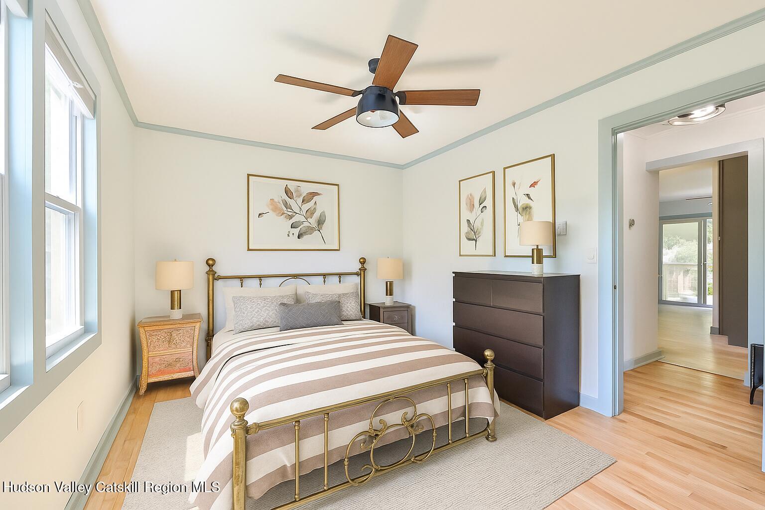 10398 Highway 23A Jewett, NY 12442 - Photo 4 of 55 a bedroom with a large bed and a chandelier