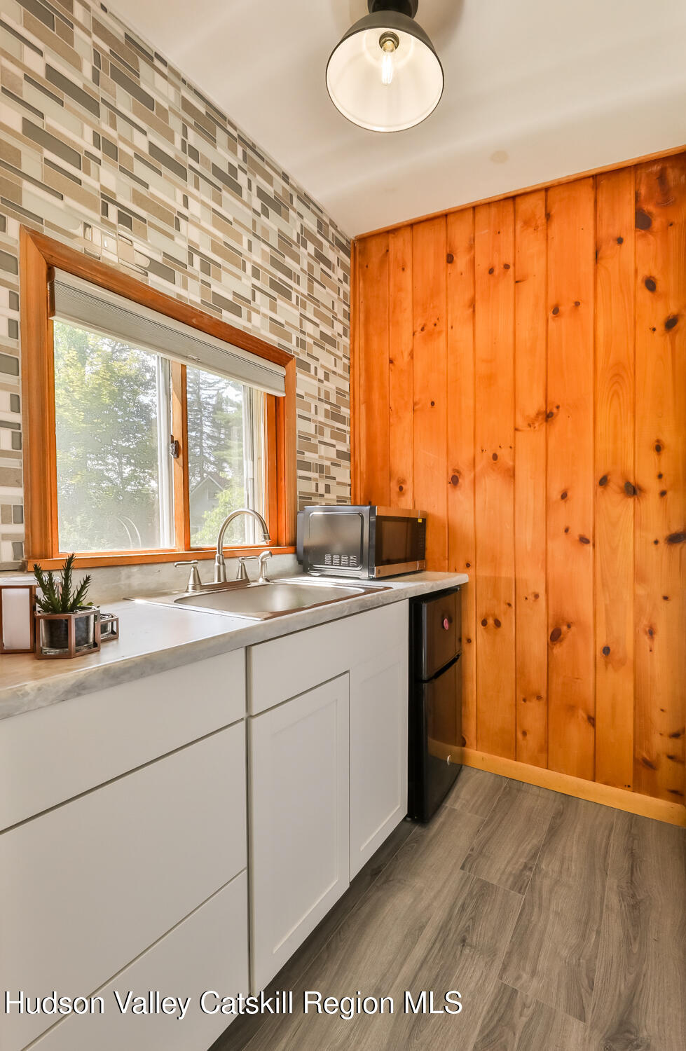 10398 Highway 23A Jewett, NY 12442 - Photo 44 of 55 a bathroom with a double vanity sink and a large mirror