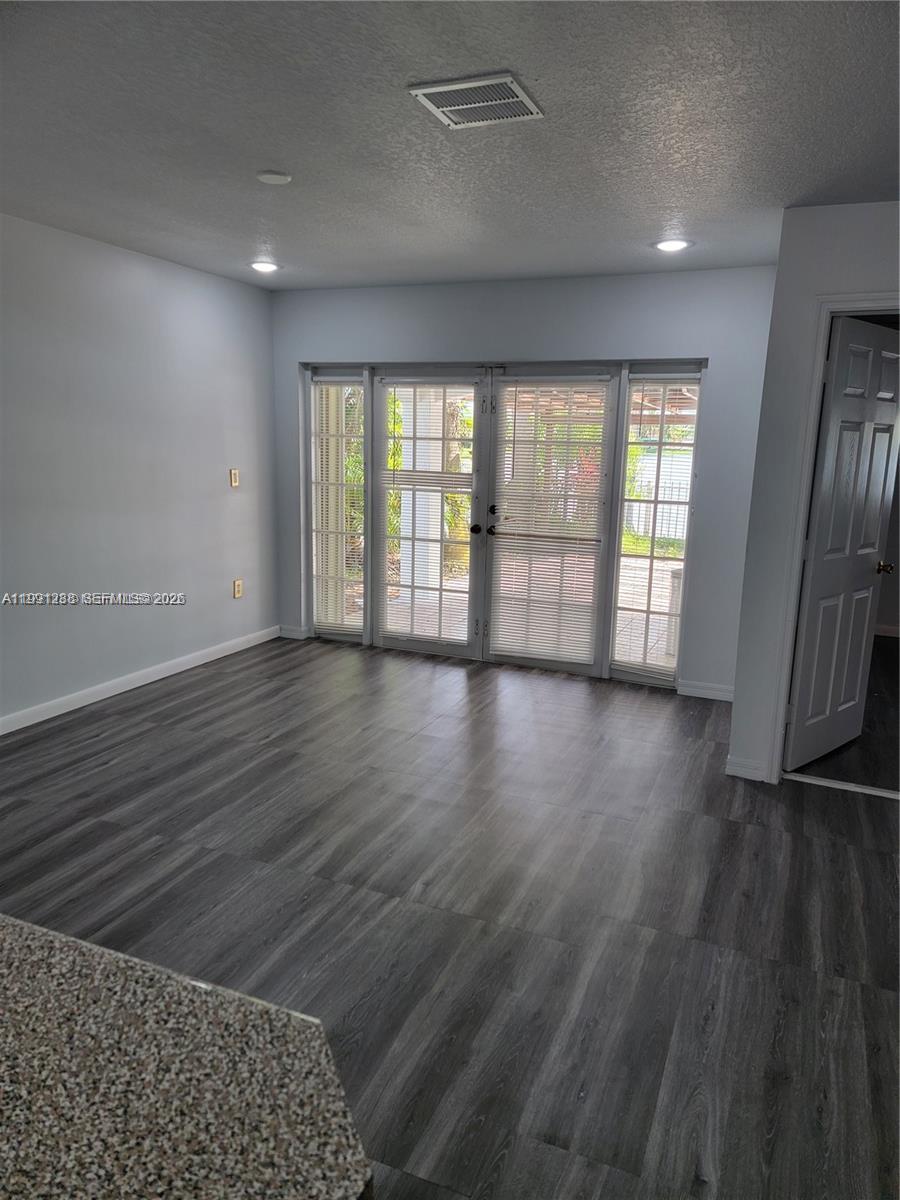 3333 Southwest 156th Court Miami, FL 33185 - Photo 12 of 33 wooden floor in an empty room with a window