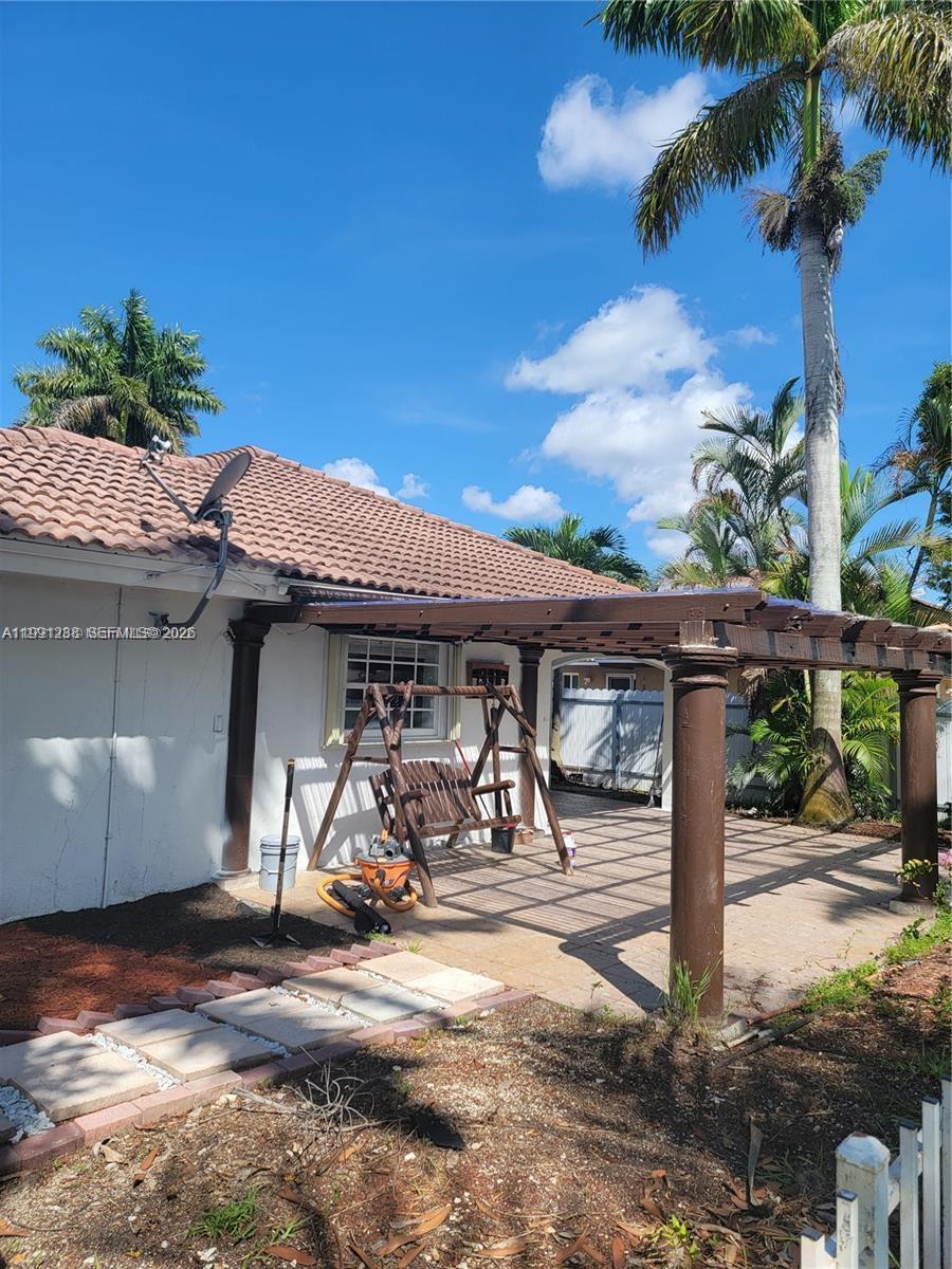 3333 Southwest 156th Court Miami, FL 33185 - Photo 25 of 33 a front view of a house with garden
