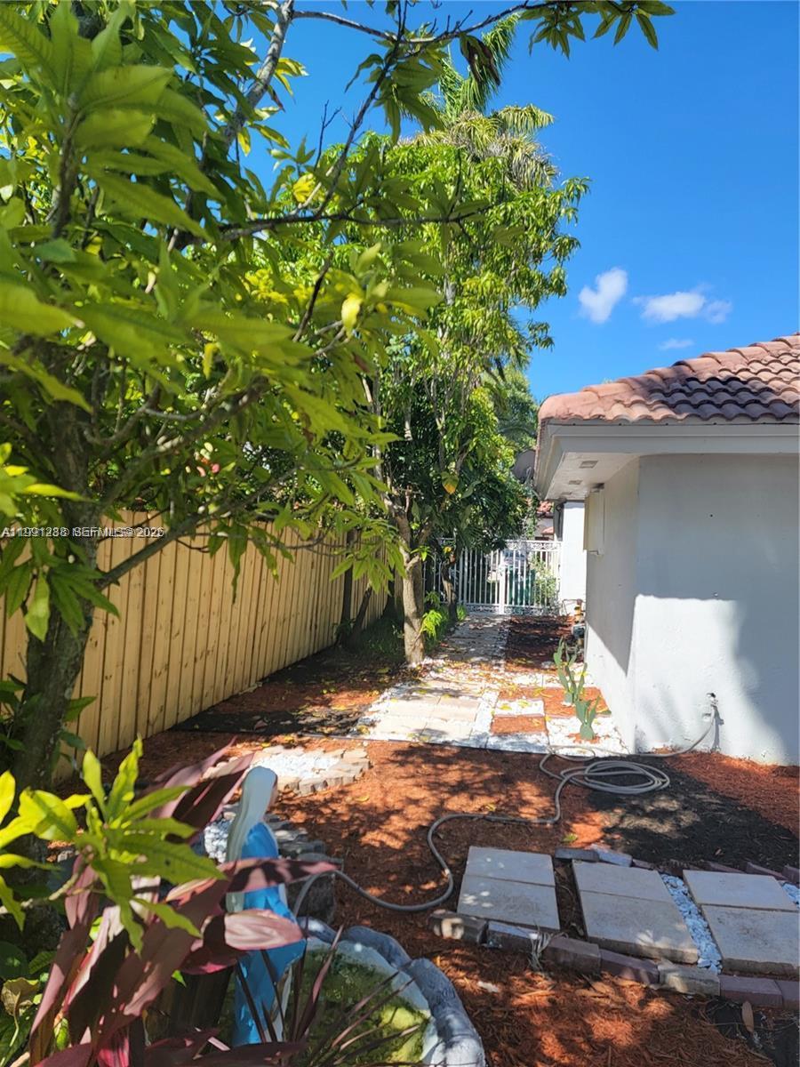 3333 Southwest 156th Court Miami, FL 33185 - Photo 26 of 33 a view of a backyard with a tree