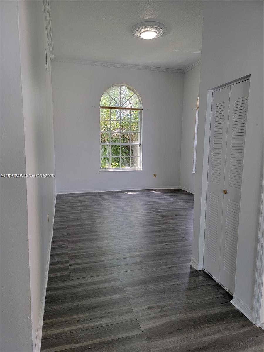 3333 Southwest 156th Court Miami, FL 33185 - Photo 3 of 33 an empty room with wooden floor and windows