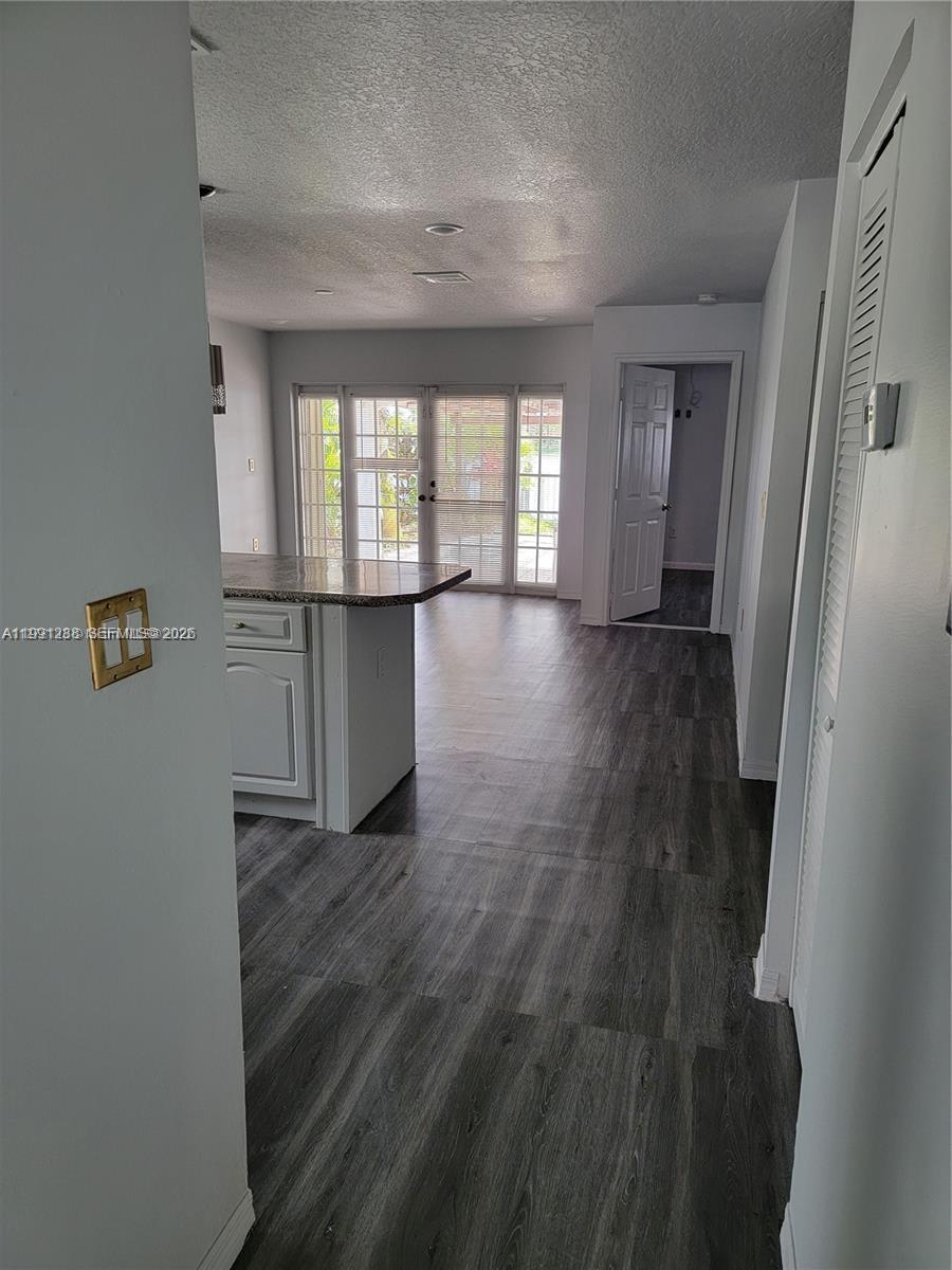 3333 Southwest 156th Court Miami, FL 33185 - Photo 7 of 33 wooden floor in an empty room with a window