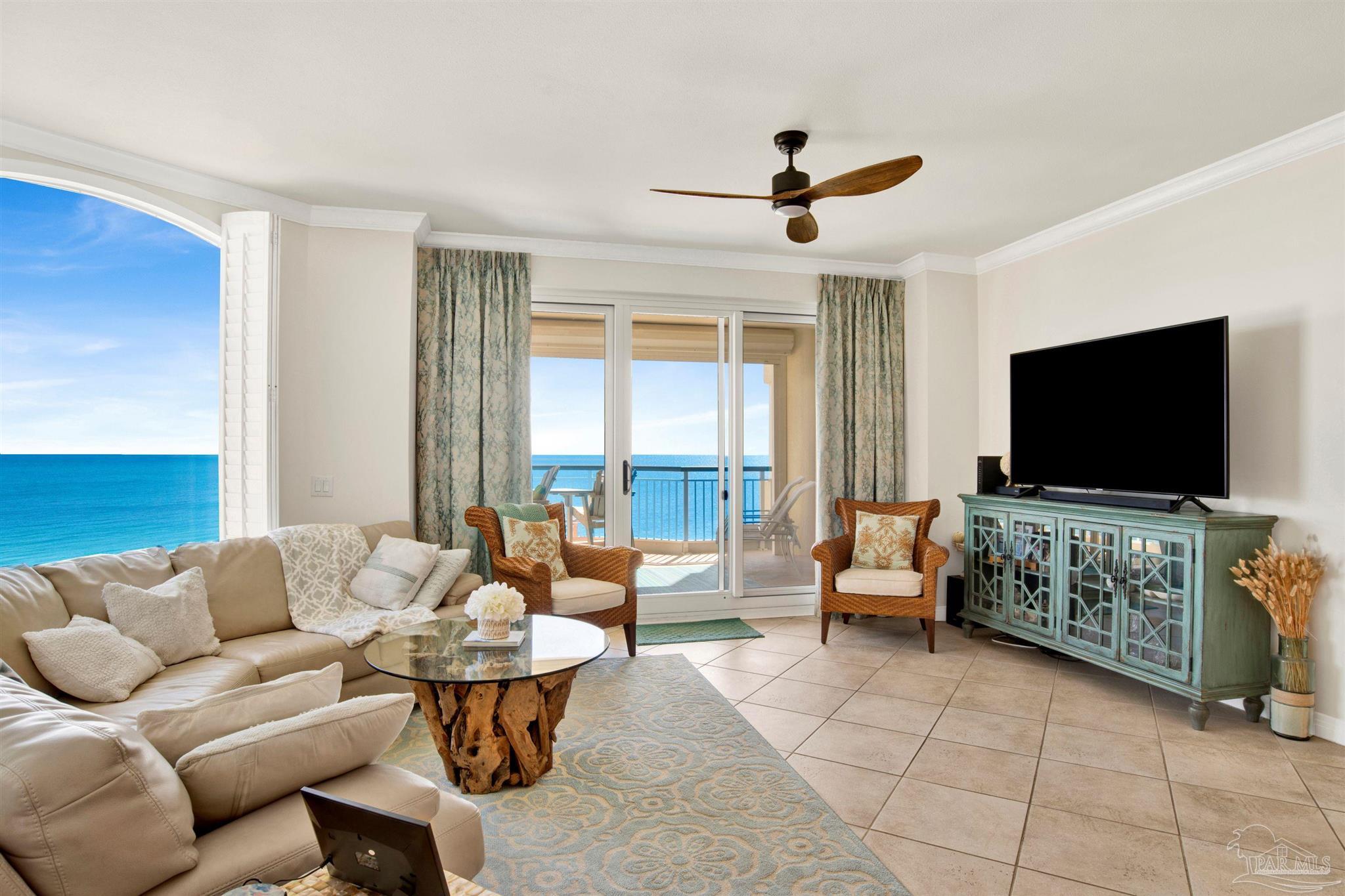 13601 Perdido Key Drive, Unit W10B Pensacola, FL 32507 - Photo 6 of 25 a living room with furniture and a flat screen tv