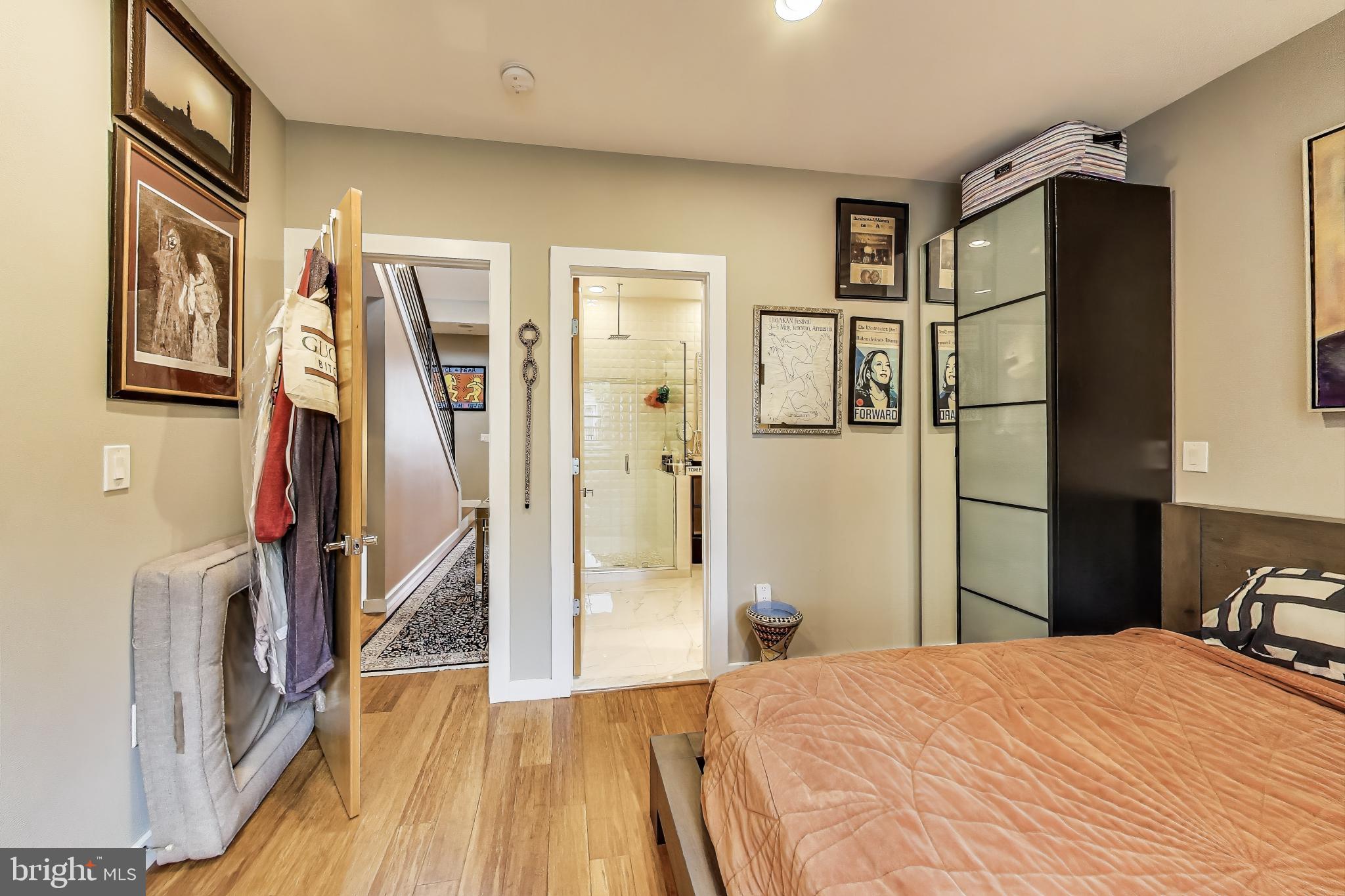 1242 New Jersey Avenue Northwest Washington, DC 20001 - Photo 11 of 60 a bedroom with a bed and a flat screen tv