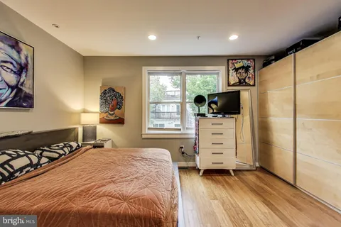 a bedroom with a large bed and a window