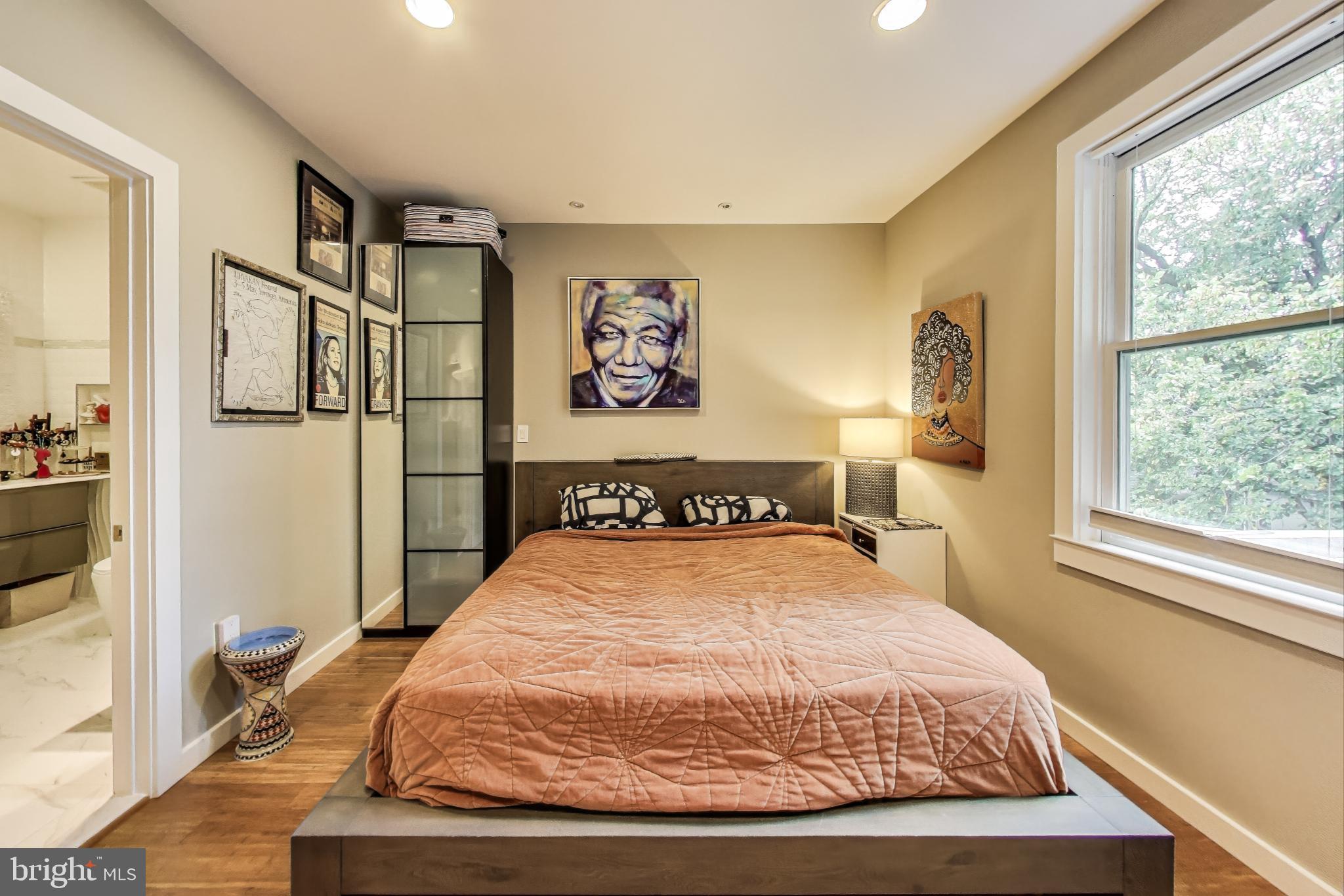 1242 New Jersey Avenue Northwest Washington, DC 20001 - Photo 13 of 60 a bedroom with a large bed and a window