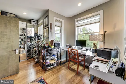 a living room with bookshelf and a book shelf