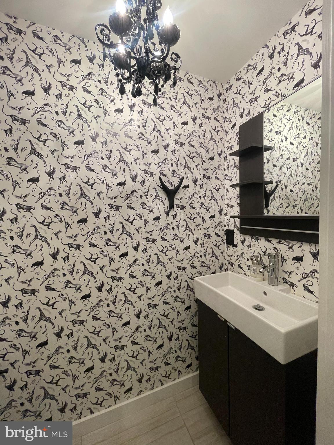 1242 New Jersey Avenue Northwest Washington, DC 20001 - Photo 35 of 60 a bathroom with a sink and a mirror