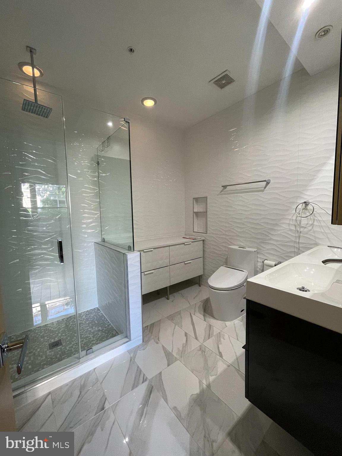 1242 New Jersey Avenue Northwest Washington, DC 20001 - Photo 43 of 60 a bathroom with a sink and a toilet