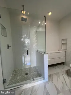 a backyard of a house with plants and tree