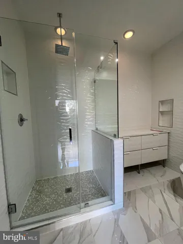 a backyard of a house with plants and tree