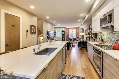 a kitchen with a sink and cabinets