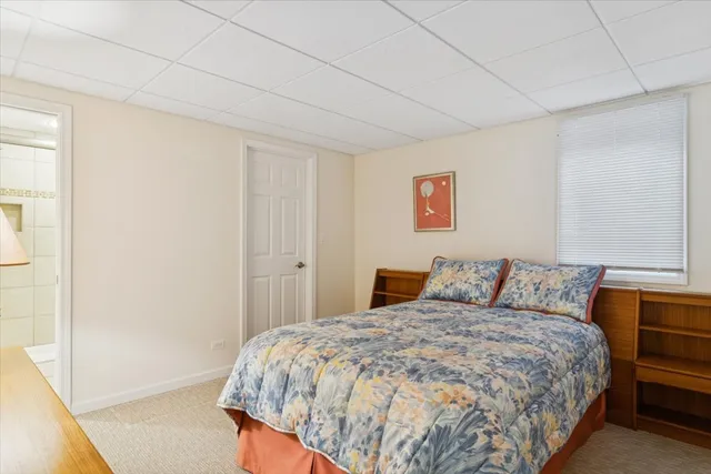 a bedroom with a bed and a cabinets