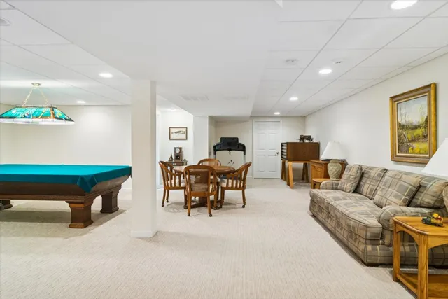 a living room with furniture and a table