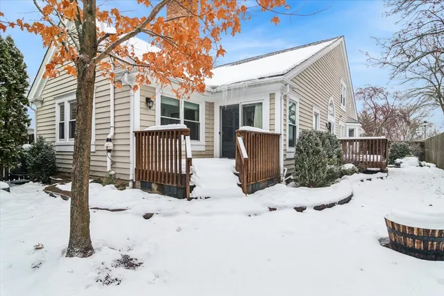 a view of a house with snow on the road
