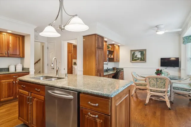 a view of a kitchen wooden cabinets and a counter top space