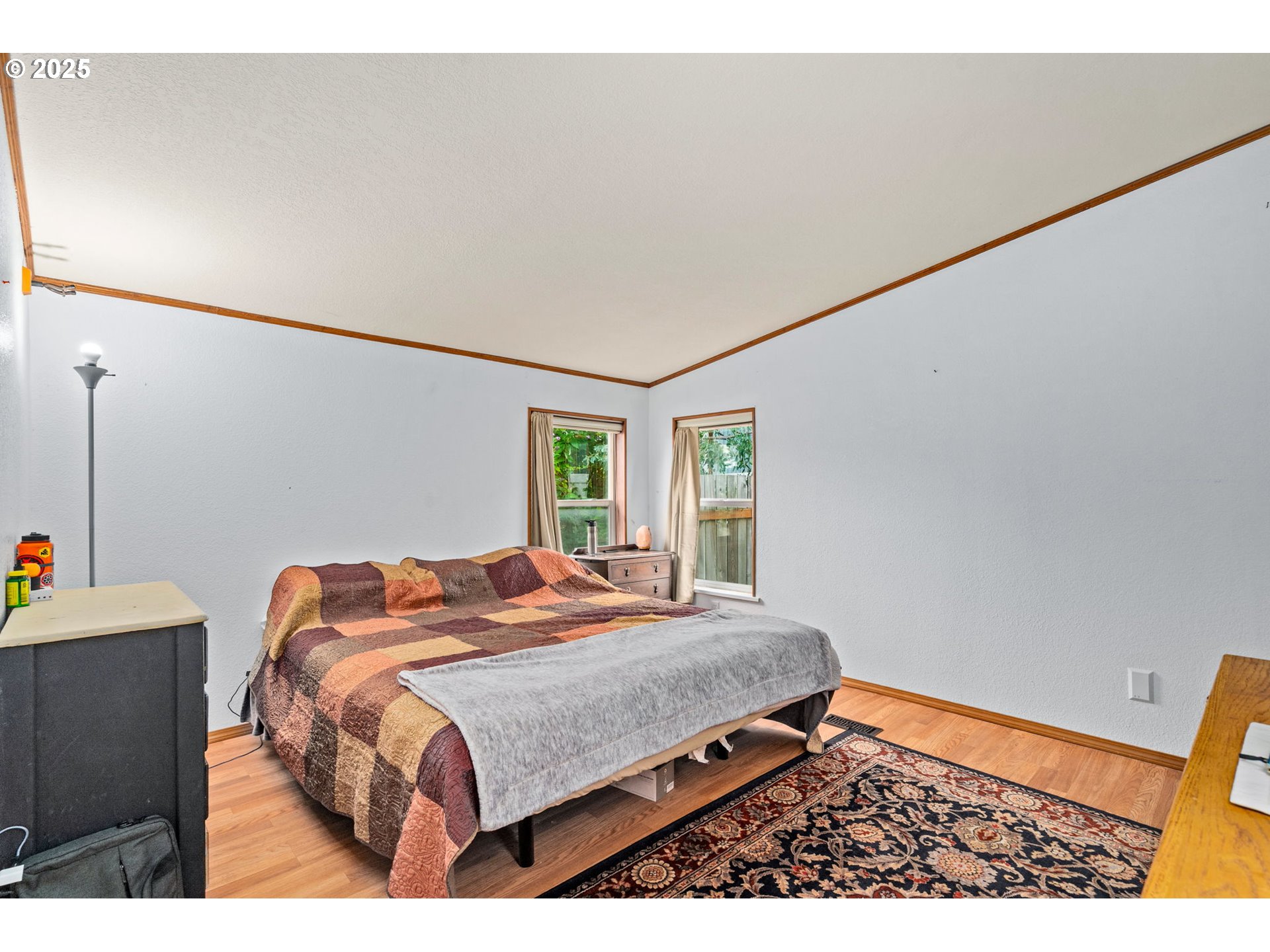 614 South 10th Street St. Helens, OR 97051 - Photo 20 of 32 a bedroom with a bed and a dresser