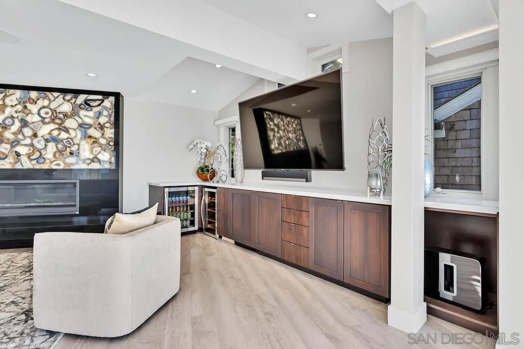 274 Coast Boulevard La Jolla, CA 92037 - Photo 11 of 64 a living room with furniture and a flat screen tv