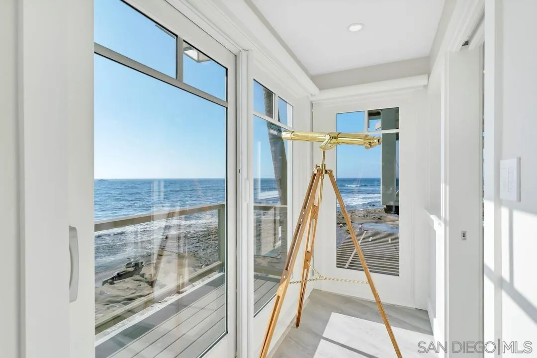 274 Coast Boulevard La Jolla, CA 92037 - Photo 16 of 64 a view of a hallway with wooden floor and entryway