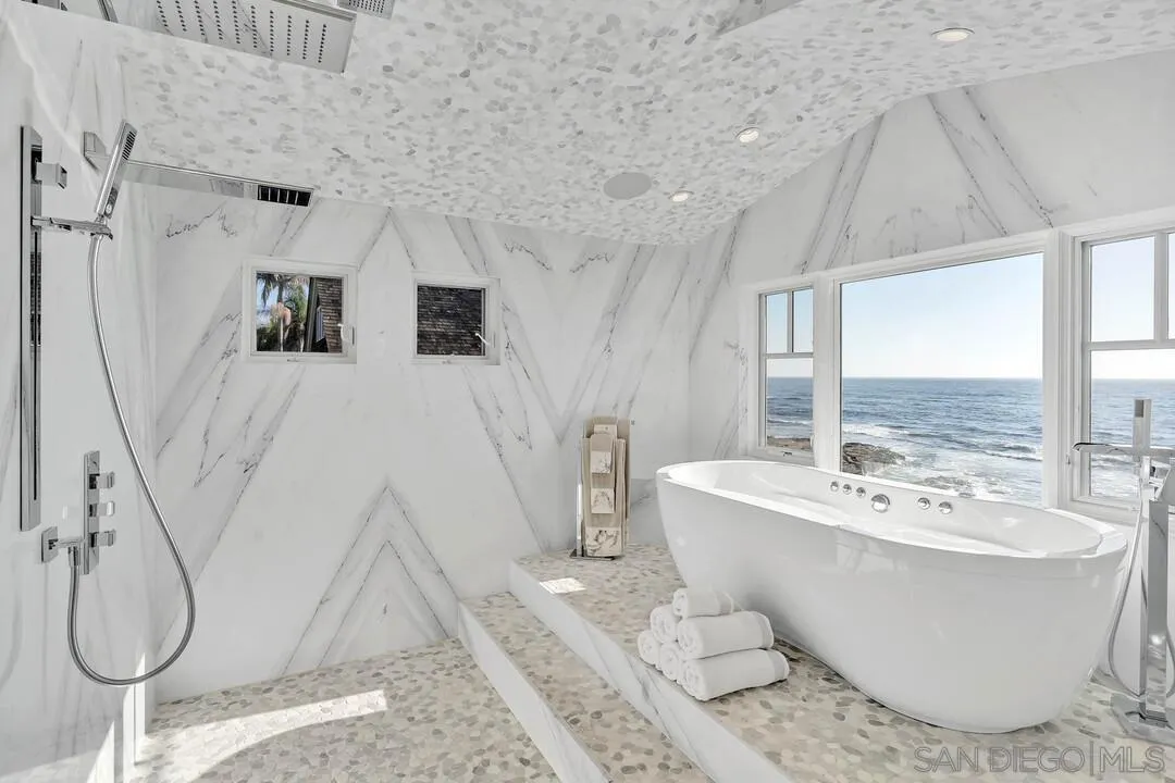 274 Coast Boulevard La Jolla, CA 92037 - Photo 29 of 64 a white bath tub sitting next to a white sink