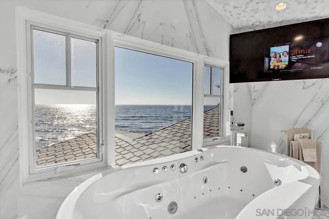 274 Coast Boulevard La Jolla, CA 92037 - Photo 31 of 64 a bathroom with a bathtub and a shower