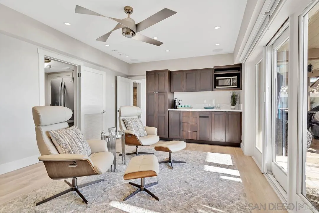 274 Coast Boulevard La Jolla, CA 92037 - Photo 33 of 64 a living room with furniture and a rug