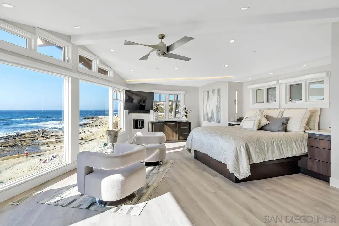 274 Coast Boulevard La Jolla, CA 92037 - Photo 4 of 64 a living room with furniture and a large window