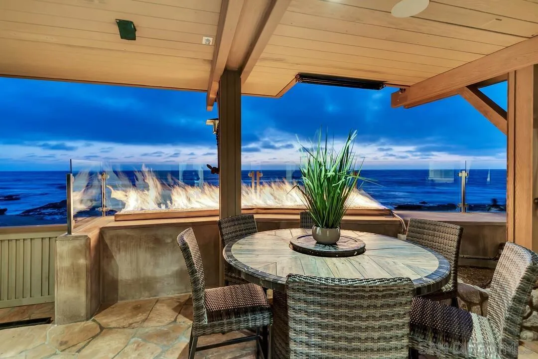 274 Coast Boulevard La Jolla, CA 92037 - Photo 46 of 64 a view of a dining room with furniture and wooden floor