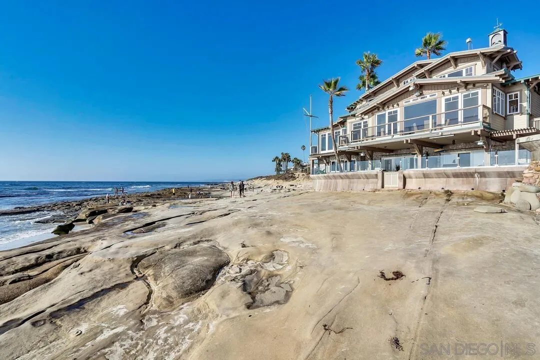 274 Coast Boulevard La Jolla, CA 92037 - Photo 51 of 64 a view of a big house with a big yard and large trees