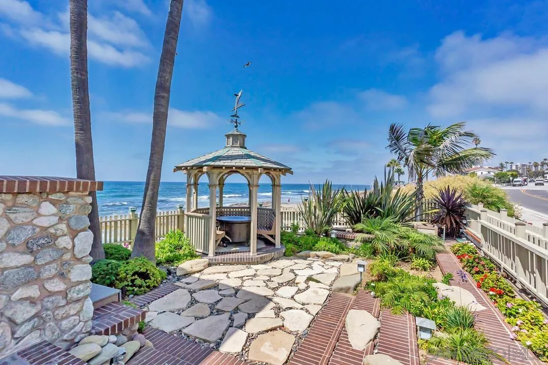274 Coast Boulevard La Jolla, CA 92037 - Photo 55 of 64 a front view of a house with a yard