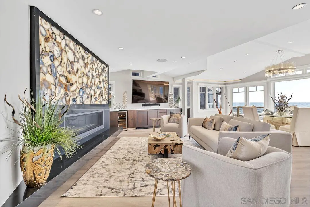 274 Coast Boulevard La Jolla, CA 92037 - Photo 9 of 64 a living room with furniture or couch and a potted plant