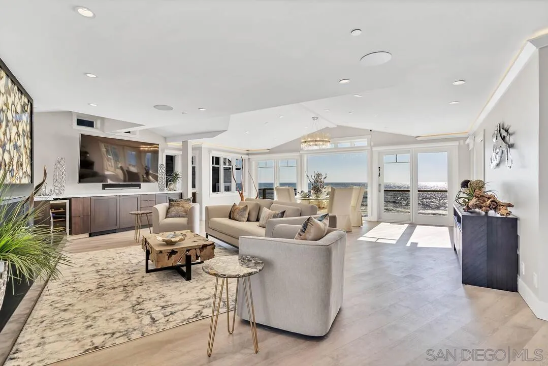 274 Coast Boulevard La Jolla, CA 92037 - Photo 10 of 64 a living room with furniture and a flat screen tv
