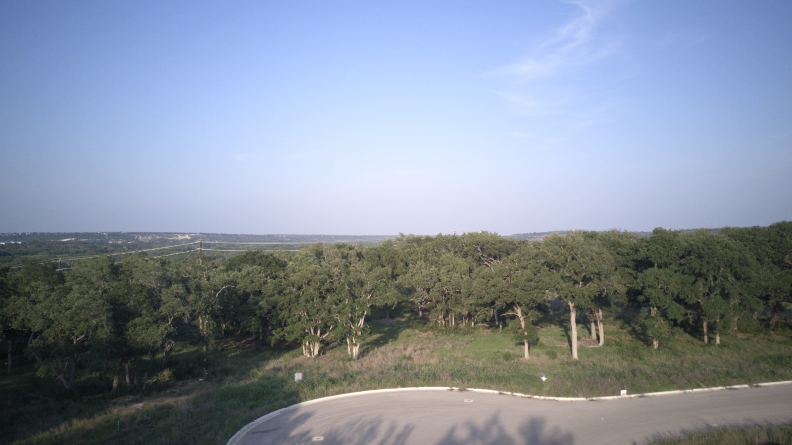 a view of a lake in middle of forest