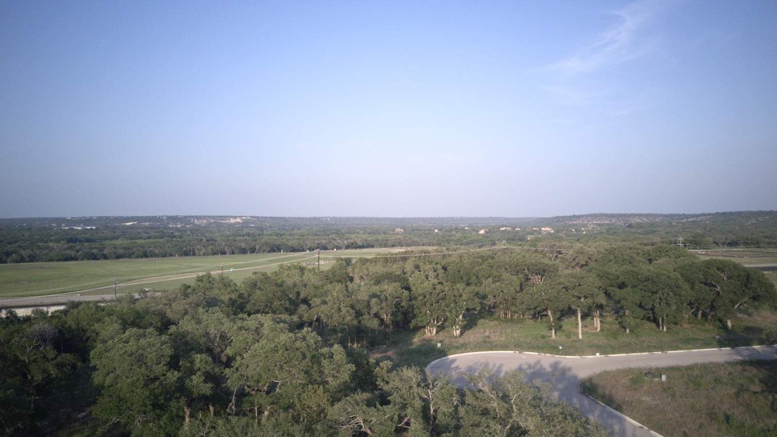 148 West Rio Ranch Road Liberty Hill, TX 78642 - Photo 7 of 11 a view of a field with an trees